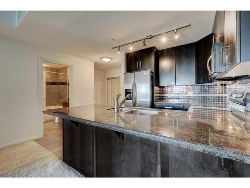 709-1410 1 Street Se, Calgary, AB - Indoor Photo Showing Kitchen With Double Sink