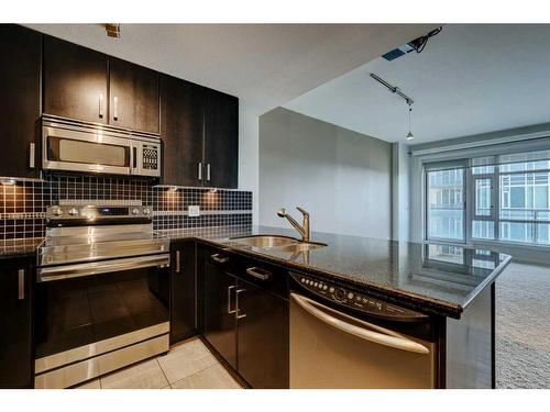 709-1410 1 Street Se, Calgary, AB - Indoor Photo Showing Kitchen With Double Sink