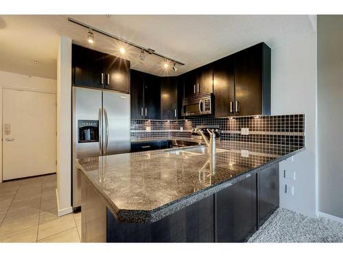 709-1410 1 Street Se, Calgary, AB - Indoor Photo Showing Kitchen With Double Sink