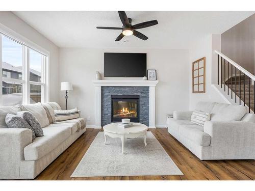 260 Paint Horse Drive, Cochrane, AB - Indoor Photo Showing Living Room With Fireplace
