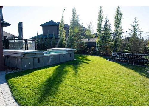 32 Watermark Avenue, Rural Rocky View County, AB - Outdoor With Above Ground Pool With Backyard