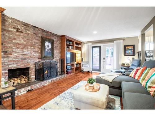 644 Wilderness Drive Se, Calgary, AB - Indoor Photo Showing Living Room With Fireplace