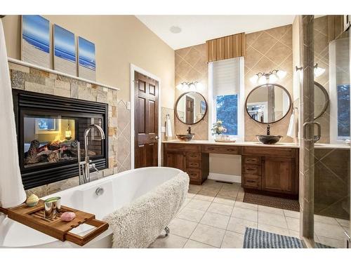 644 Wilderness Drive Se, Calgary, AB - Indoor Photo Showing Bathroom With Fireplace