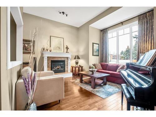 644 Wilderness Drive Se, Calgary, AB - Indoor Photo Showing Living Room With Fireplace