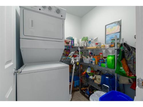 408-128 Centre Avenue, Cochrane, AB - Indoor Photo Showing Laundry Room