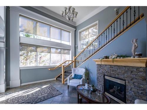408-128 Centre Avenue, Cochrane, AB - Indoor With Fireplace