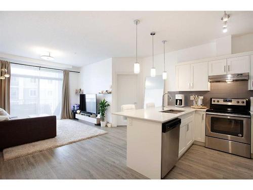 2305-522 Cranford Drive Se, Calgary, AB - Indoor Photo Showing Kitchen With Stainless Steel Kitchen With Double Sink