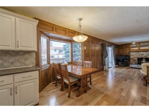 39 Edgehill Crescent Nw, Calgary, AB - Indoor Photo Showing Dining Room With Fireplace