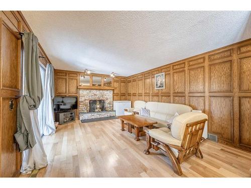 39 Edgehill Crescent Nw, Calgary, AB - Indoor Photo Showing Living Room With Fireplace