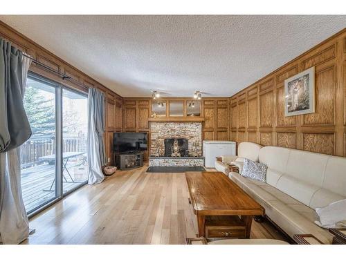 39 Edgehill Crescent Nw, Calgary, AB - Indoor Photo Showing Living Room With Fireplace