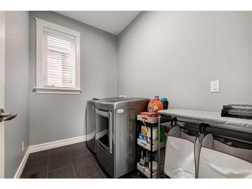 1250 Coopers Drive Sw, Airdrie, AB - Indoor Photo Showing Laundry Room