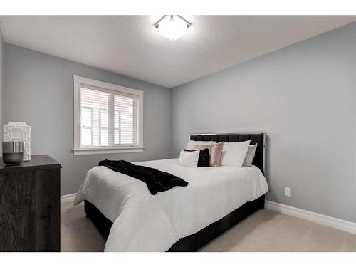 1250 Coopers Drive Sw, Airdrie, AB - Indoor Photo Showing Bedroom