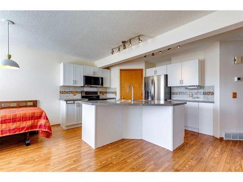 24 Somerset Park Sw, Calgary, AB - Indoor Photo Showing Kitchen With Stainless Steel Kitchen With Upgraded Kitchen