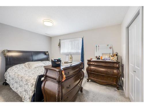 B-105 Stanley Avenue, Okotoks, AB - Indoor Photo Showing Bedroom