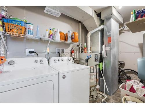 B-105 Stanley Avenue, Okotoks, AB - Indoor Photo Showing Laundry Room