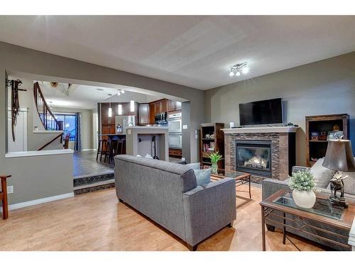 20 New Brighton Court Se, Calgary, AB - Indoor Photo Showing Living Room With Fireplace