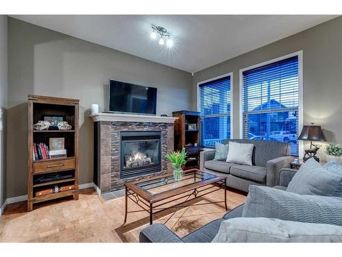20 New Brighton Court Se, Calgary, AB - Indoor Photo Showing Living Room With Fireplace