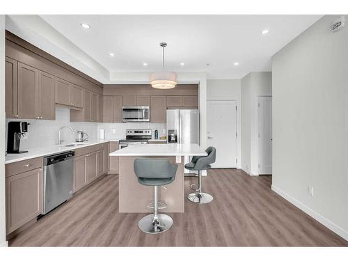 208-30 Shawnee Common Sw, Calgary, AB - Indoor Photo Showing Kitchen With Stainless Steel Kitchen With Upgraded Kitchen