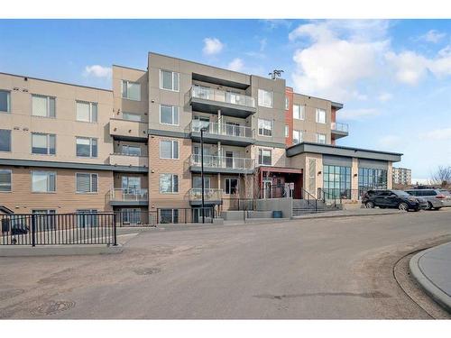 208-30 Shawnee Common Sw, Calgary, AB - Outdoor With Facade