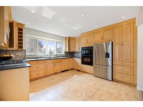 79 Wood Crescent Sw, Calgary, AB - Indoor Photo Showing Kitchen With Double Sink
