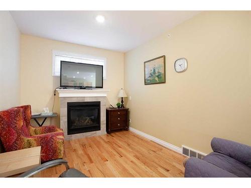 42 Violet Close, Olds, AB - Indoor Photo Showing Living Room With Fireplace