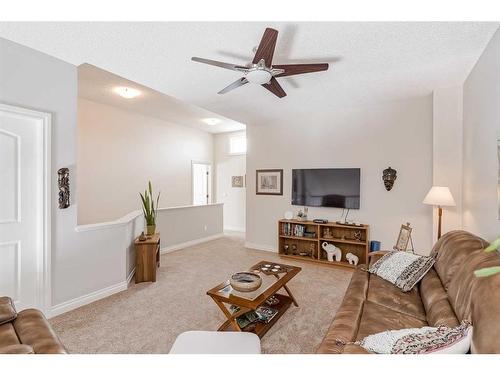 211 Sunset Square, Cochrane, AB - Indoor Photo Showing Living Room