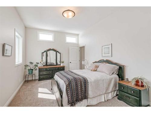 211 Sunset Square, Cochrane, AB - Indoor Photo Showing Bedroom