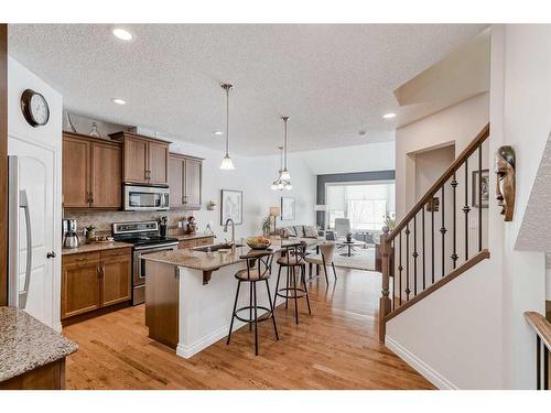 211 Sunset Square, Cochrane, AB - Indoor Photo Showing Kitchen With Stainless Steel Kitchen With Upgraded Kitchen