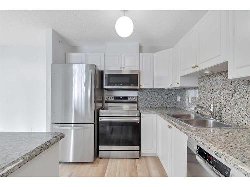 412-6000 Somervale Court Sw, Calgary, AB - Indoor Photo Showing Kitchen With Double Sink