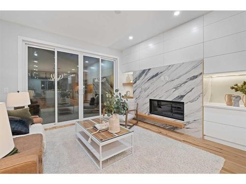 1725 23 Avenue Nw, Calgary, AB - Indoor Photo Showing Living Room With Fireplace