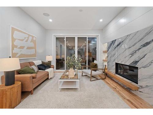 1725 23 Avenue Nw, Calgary, AB - Indoor Photo Showing Living Room With Fireplace