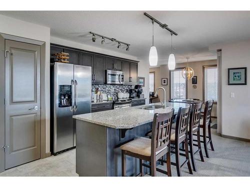 2303-310 Mckenzie Towne Gate Se, Calgary, AB - Indoor Photo Showing Kitchen With Double Sink