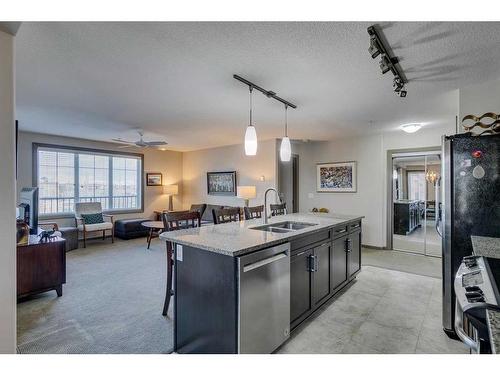 2303-310 Mckenzie Towne Gate Se, Calgary, AB - Indoor Photo Showing Kitchen With Double Sink