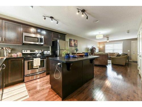 209 Rainbow Falls Manor, Chestermere, AB - Indoor Photo Showing Kitchen