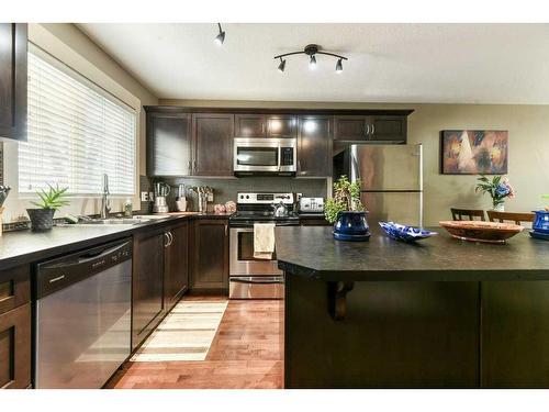 209 Rainbow Falls Manor, Chestermere, AB - Indoor Photo Showing Kitchen