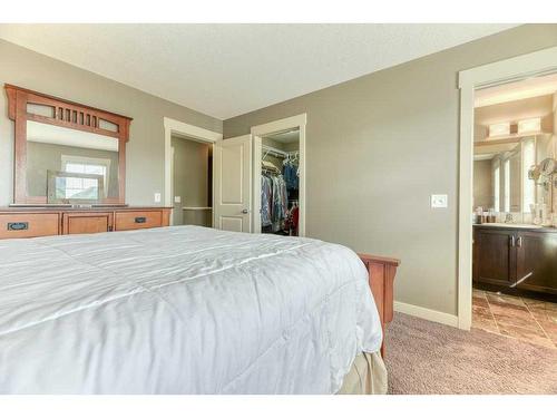 209 Rainbow Falls Manor, Chestermere, AB - Indoor Photo Showing Bedroom