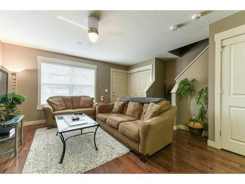 209 Rainbow Falls Manor, Chestermere, AB - Indoor Photo Showing Living Room