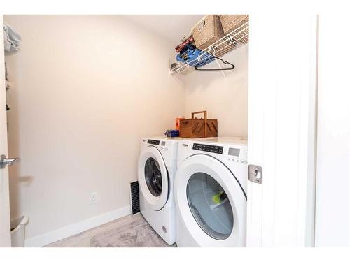 124 Emberside Place, Cochrane, AB - Indoor Photo Showing Laundry Room