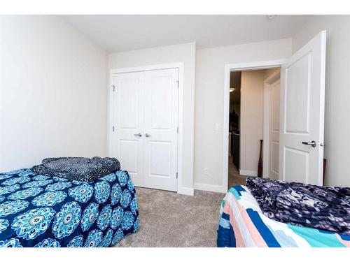 124 Emberside Place, Cochrane, AB - Indoor Photo Showing Bedroom