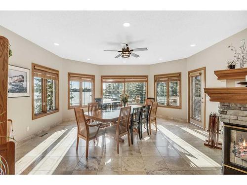 76 Chaparral Cove Se, Calgary, AB - Indoor Photo Showing Dining Room With Fireplace