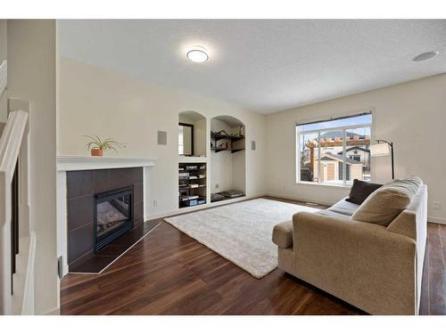 1260 Everridge Drive Sw, Calgary, AB - Indoor Photo Showing Living Room With Fireplace