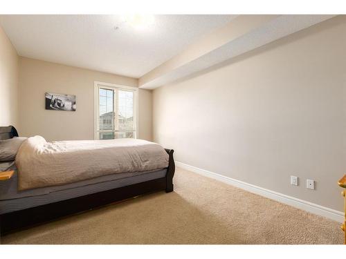 3206-15 Sunset Square, Cochrane, AB - Indoor Photo Showing Bedroom