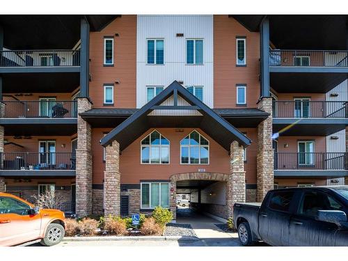 3206-15 Sunset Square, Cochrane, AB - Outdoor With Balcony With Facade