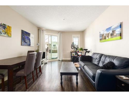 3206-15 Sunset Square, Cochrane, AB - Indoor Photo Showing Living Room