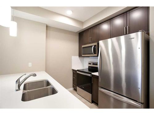 107-30 Mahogany Mews Se, Calgary, AB - Indoor Photo Showing Kitchen With Double Sink