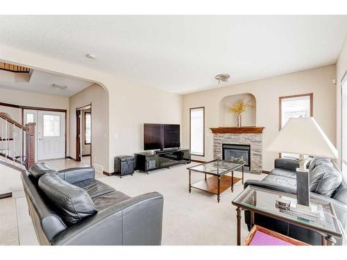 621 Cavendish Beach Bay, Chestermere, AB - Indoor Photo Showing Living Room With Fireplace