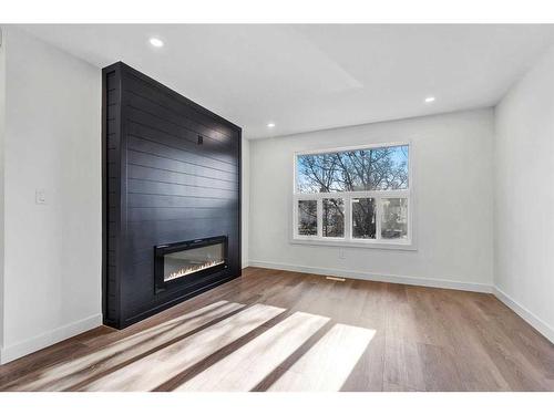 3213 Dover Road Se, Calgary, AB - Indoor Photo Showing Living Room With Fireplace