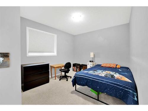 233 Sunset Heights, Cochrane, AB - Indoor Photo Showing Bedroom