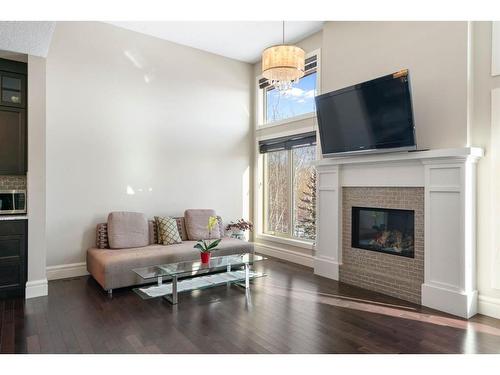 26 Walden Close Se, Calgary, AB - Indoor Photo Showing Living Room With Fireplace