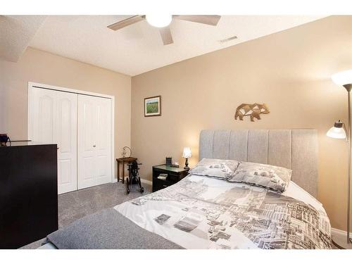 78 Gleneagles Close, Cochrane, AB - Indoor Photo Showing Bedroom